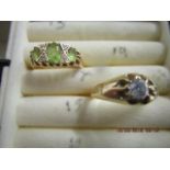 Two yellow metal gen set rings, one a diamond solitaire, the other set with three peridots, total