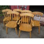 A set of six modern beech kitchen lathe back chairs to include two carvers