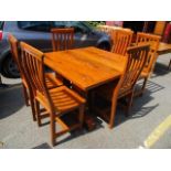 A modern stinkwood dining table, together with six matching dining chairs, 32"h x 51"w