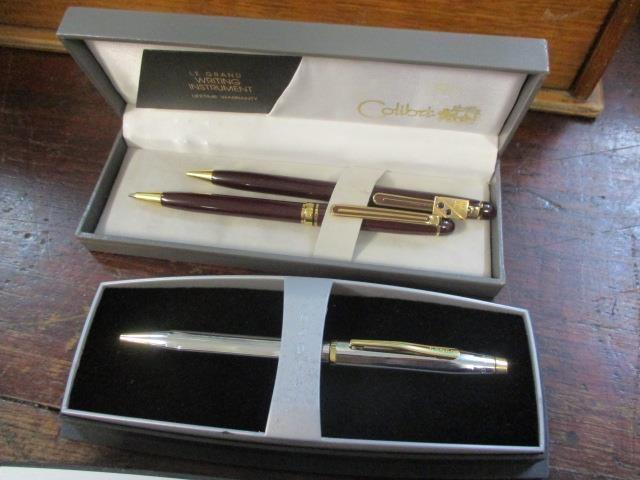 Two boxed Colibri Le Grand pens, together with a boxed Cross pen