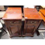 A pair of early 20th century mahogany pedestal cabinets having swan neck handles, single drawer