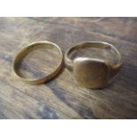 An 18ct gold wedding band 3.2g and a 9ct gold signet ring 5.2g