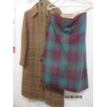 A mid 20th century tweed Erie ladies coat together with a ladies tartan kilt, possibly a Fraser