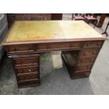 A Victorian mahogany twin pedestal desk having a leather topped scriber, one long drawer and eight