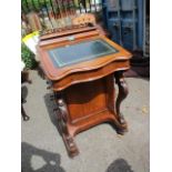 A Victorian walnut Davenport having a green leather top, four drawers and scrolled supports, 36" h x