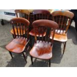 A set of five early 20th century, elm seated kitchen chairs, standing on turned legs