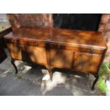 An early 20th century mahogany sideboard having two long drawers with cupboard doors below and