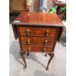 An early 20th century walnut work table with two fall flaps and three drawers, 29 1/2" h, 15"w