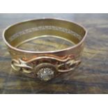 An Italian gold coloured bracelet with pierced and scrolled ornament set with paste stones,