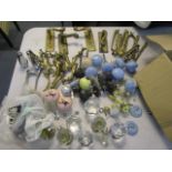 A selection of brass, porcelain and glass door knobs, handles and window latches