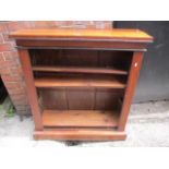 A Victorian bookcase having three fitted shelves and standing on a plinth base, 40" h x 36"w