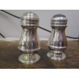 A pair of silver salt and pepper pots of baluster form, 173g