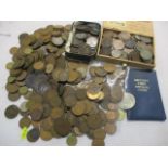 A collection of uncirculated coins to include Victorian and later pennies