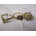 Three 9ct gold rings, two set with diamonds and another with diamonds and rubies, 7.4g