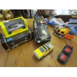 A selection of boxed and unboxed model cars and vehicle and a helicopter to include a Maisto Special