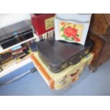 A mixed lot of vintage suitcases, a metal deeds box and magazine racks