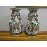 A pair of early 20th century Chinese porcelain vases decorated with various figures, 13 2/8" high