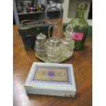 A mixed lot comprising early 20th century opera glasses, cased, a silver plated cruet set, playing