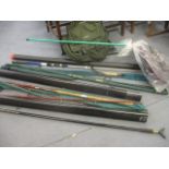 A Crazy Left 320 spinner rod, a Flueger Medalist 2-piece rod, an Abu rod, a Wilson Masterline rod, a