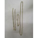 A 9ct gold Italian chain necklace, a 9ct gold bracelet and two other 9ct gold chains, total weight