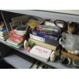 A mixed lot to include books, a golf ball, board games, mirrors, oil paintings and other items