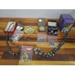 A mixed lot of costume jewellery to include a Venetian and a Bohemian glass necklaces, compact