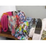 A collection of scarves, to include leather belts, a faux fur throw and a twin handled basket