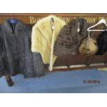A selection of mid to late 20th century fur clothing to include two mink hats and an arctic wrap