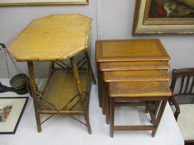 A late Victorian bamboo and rattan table and a nesting set of four carved teak occasional tables