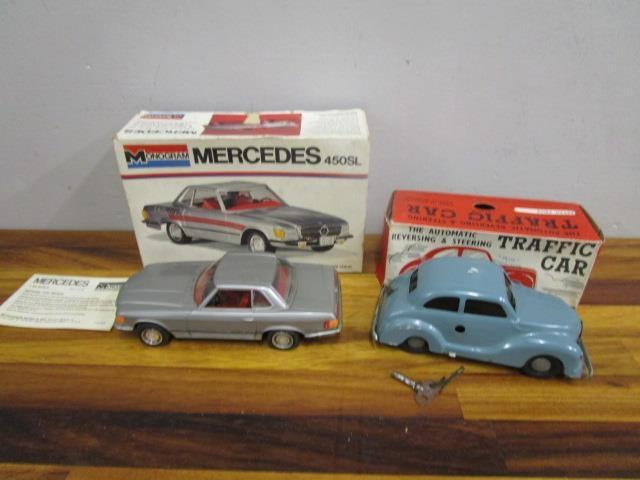 A boxed clockwork Traffic car with key and an American boxed 1.24 monogrammed model of a Mercedes