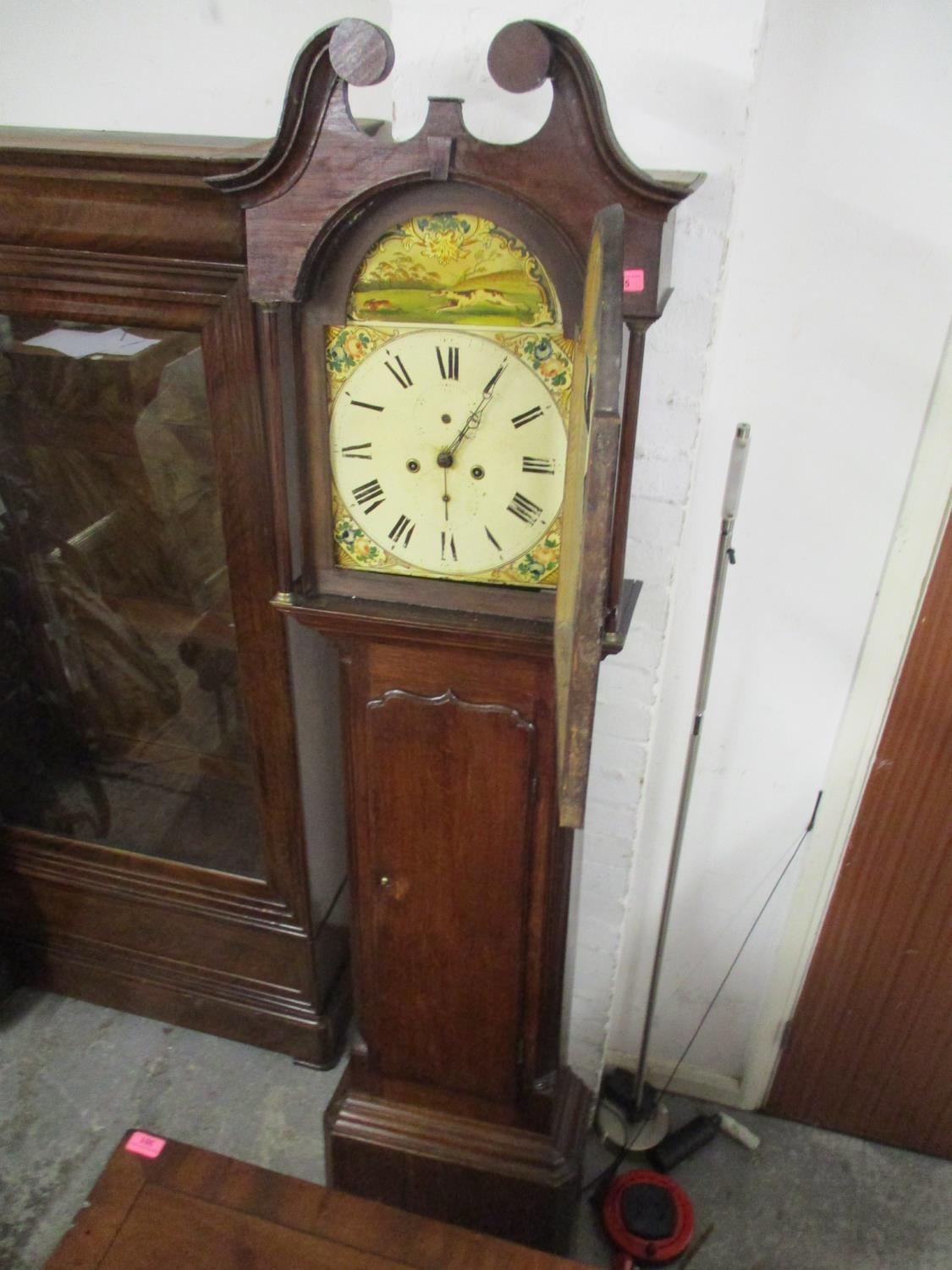 A 19th century oak longcase clock with a painted dial and 30hr movement