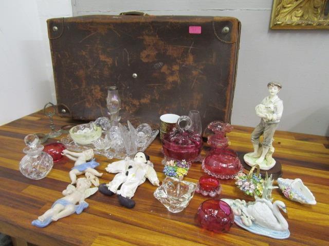 A mixed lot to include cranberry glassware, a vintage suitcase, Lladro and other items