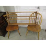 Ercol furniture to include a plate rack and two spindle back chairs