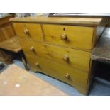 A 19th century pine chest of two short and two long drawers having bun shaped handles 37 1/2"h x