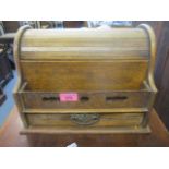 An early 20th century oak roll top desk tidy