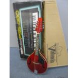 A Valencia Aria Mandolin in original box, together with a Yamaha porta sound keyboard