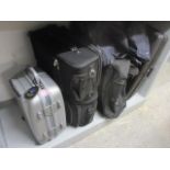 Six suitcases to include a Delsey, three wheelie cases and canvas style examples