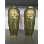 A pair of Chinese brass vases, circa 1920 decorated with dragons, 9 1/2"h