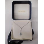 A Bucherer white gold coloured necklace with a stick pendant set with diamonds and a pale blue