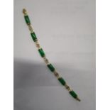 A 14k yellow gold and green jade Chinese bracelet