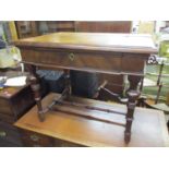 A 19th century French side table having a hinged top revealing two drawers and a mirror, standing on