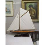 A model of a Cornish Crabber yacht on a stand