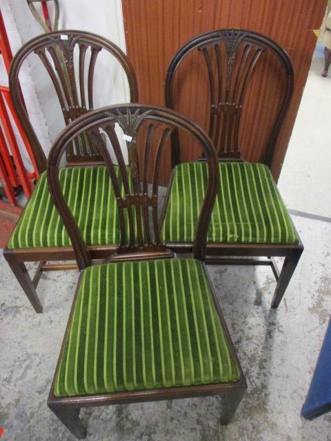 A set of seven Hepplewhite style mahogany dining chairs