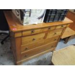 A modern French style cherrywood chest of seven drawers standing on bracket feet 37"h x 45"w