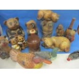 Painted, carved wooden models to include teddy bears, cats, pigs and three ducks, together with a