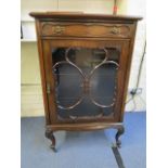 A late Victorian mahogany display cabinet with single drawer above astragal glazed display door,