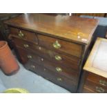 A Georgian mahogany chest of two short and three long drawers having inlaid banding and standing