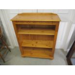 A modern pine bookcase with two shelves