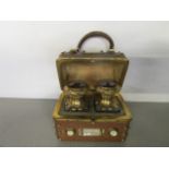 A 19th century Grand Tour, French, leather clad scent bottle casket with domed top and handle,