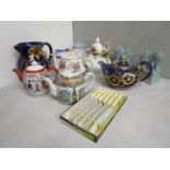 A collection of seven teapots of mixed design and miscellaneous china to include a gilt painted jug